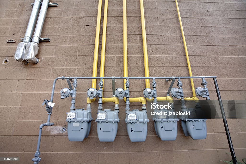 Gas meters A set of gas meters on the exterior of a building. Meter - Instrument of Measurement Stock Photo