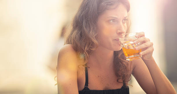 istock Woman drink an italian soft cocktail with sunlight 184642219
