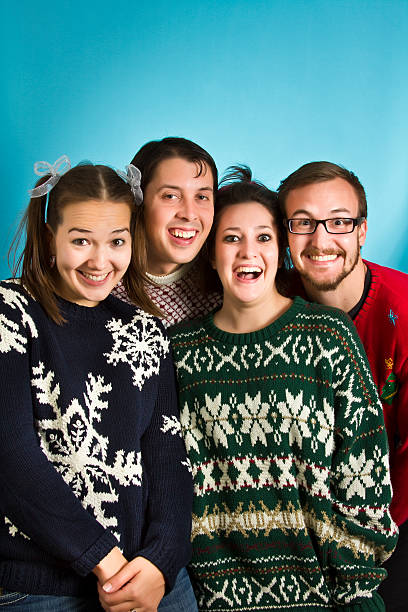 Goofy Sweater Nerds Group of holiday sweater nerds christmas ugliness sweater nerd stock pictures, royalty-free photos & images