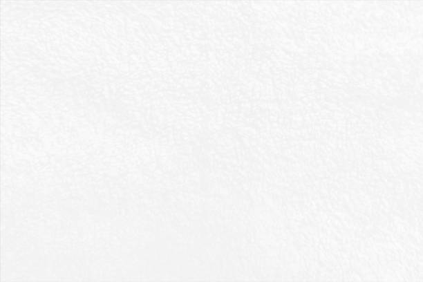 Bright light frosted look white coloured blotched, rough, textured effect modern spotted smudged blank empty horizontal vector backgrounds with subtle texture all over A horizontal vector illustration of gradient textured bright white coloured frosted backdrop, Smudges and faint texture all over with ample copy space, no people and no text. Can be used as wallpapers, textured tiles templates and designs. wallpaper wall texture stock illustrations