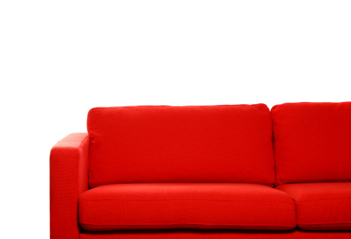 Red sofa against white background