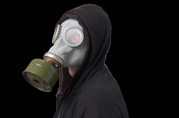 istock Hooded Man Wearing Gas Mask 184643112