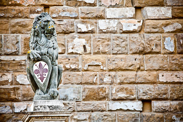 Ancient lion statue in the city of Lucca, Tuscany, Italy