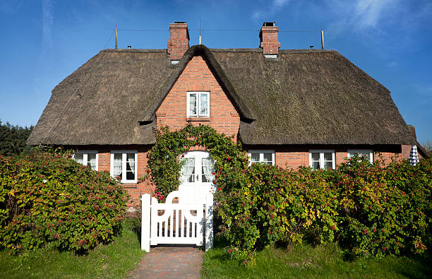 istock Beautiful Cottage with thatched straw roof 184643890