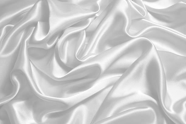 istock Close-up background image of bright white satin fabric 184643994