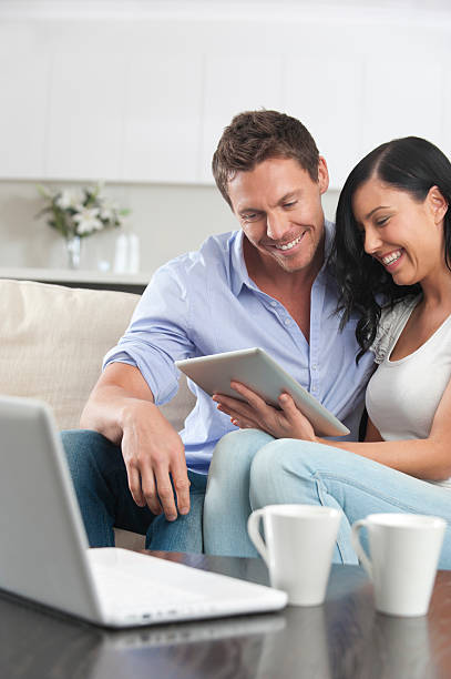 istock Couple looking at a digital tablet together 184644203