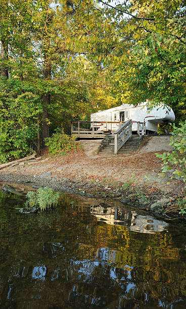 istock Fifth wheel camper in lakeside campsite during autumn 184644209