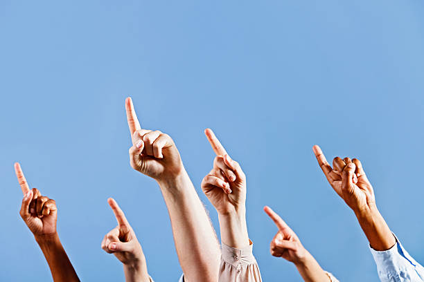 istock Over there! Hands pointing at angle up into the blue 184644243