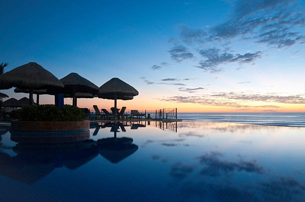 istock Sunrise over a pool overlooking the ocean 184644339