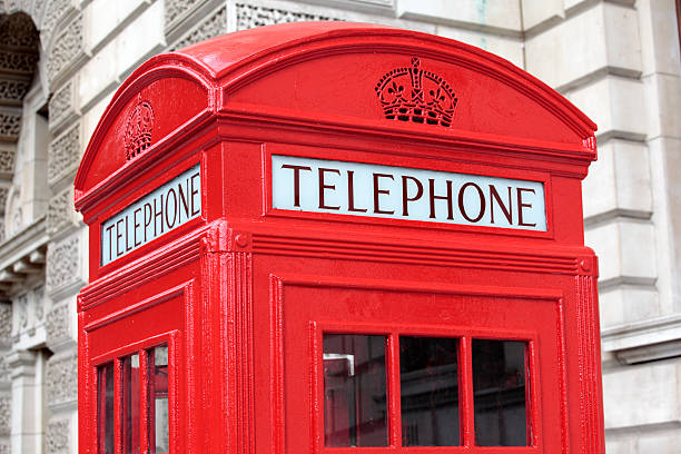 istock Telephone box with Georgian stone building 184644356