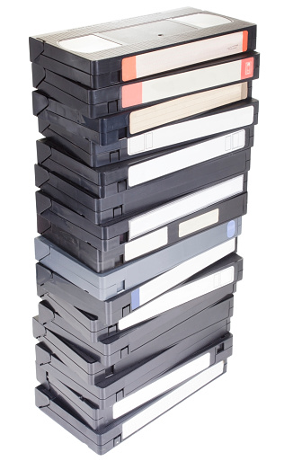 Photo of a stack of vcr tapes, isolated on white