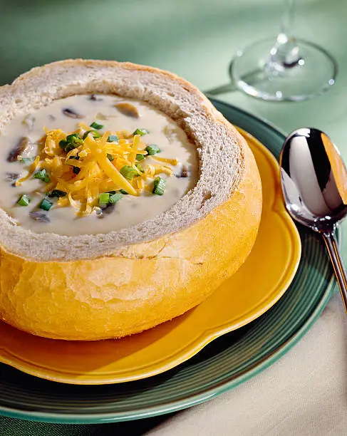 Cream of mushroom soup in bread bowl.