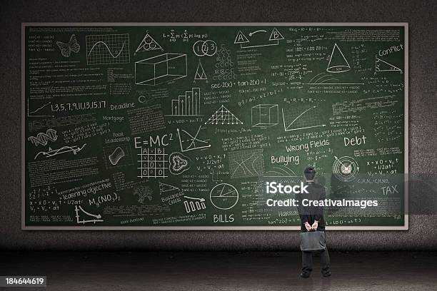 Businessman Looking At Hand Drawn Chalkboard Stock Photo - Download Image Now - Large, Chalkboard - Visual Aid, Professor