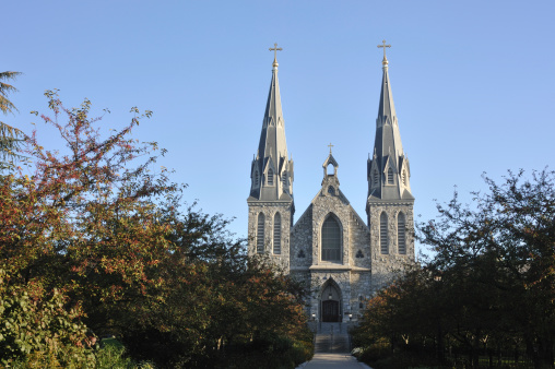 View at the bell towers and part of the church of the Catholic Maria Laach Abbey near Glees in Germany. The abbey dates back to the year1100 and is now a monastery of the Benedictine Confederation.