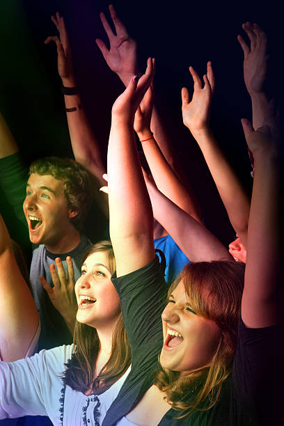 istock Teens celebrating at a concert or event 184646112