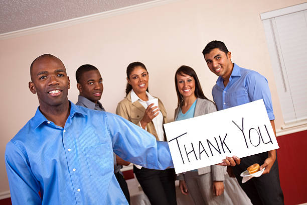 istock Young man holding a thank you sign 184646209