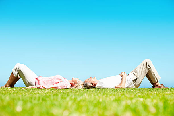 istock Senior couple lying together 184646791
