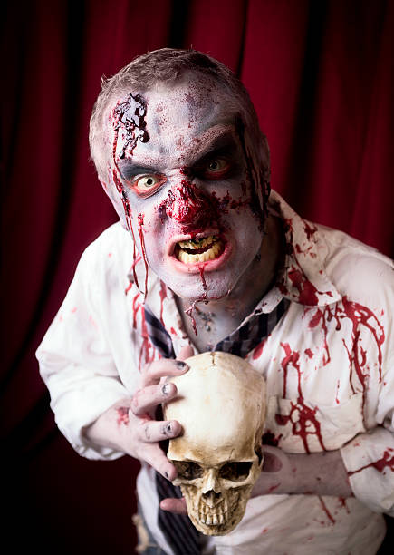 istock Bloody Zombie with a Human Skull 184646825