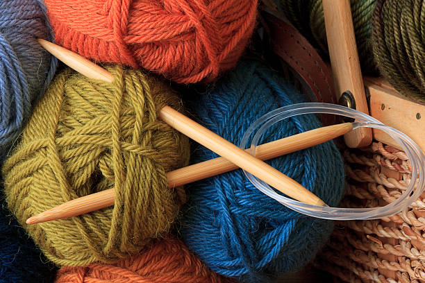 Circular Knitting Needles Circular bamboo knitting needles and colorful balls of yarn. knitting needle photos stock pictures, royalty-free photos & images