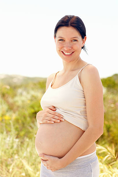 istock Happy pregnant female smiling 184647428