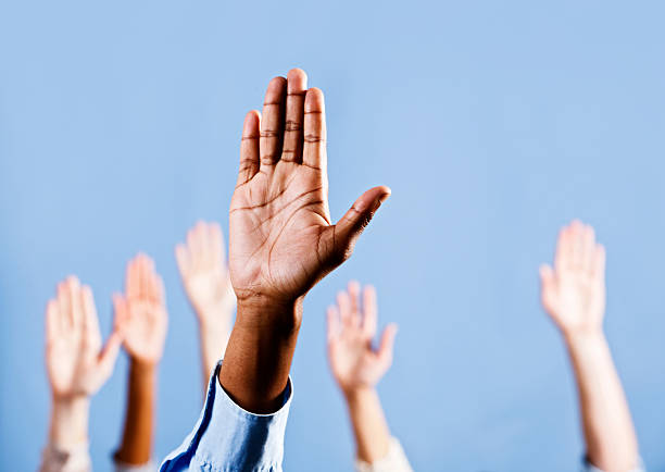 istock Choose me! Many raised hands, responding to questions or volunteering 184647752