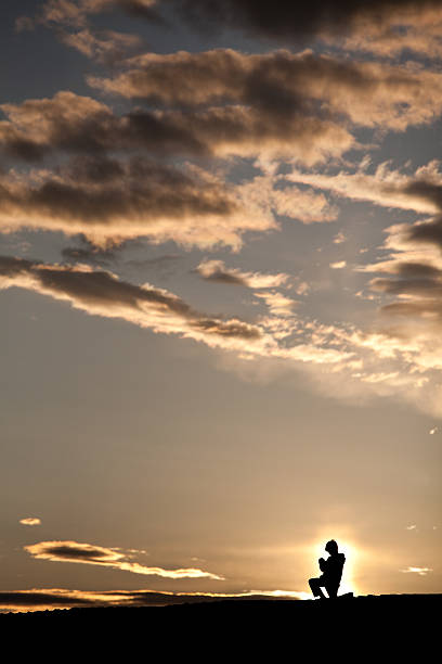 istock Silhouette of Young Boy Praying 184647801