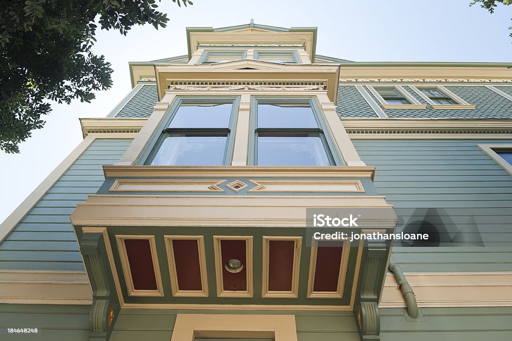 Victorian House in San Francisco Looking up at a brightly painted Victorian home in San Francisco, California. House Stock Photo