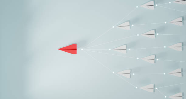 istock Leadership concept, red leader plane leading white plane, on blue background. 1846484425