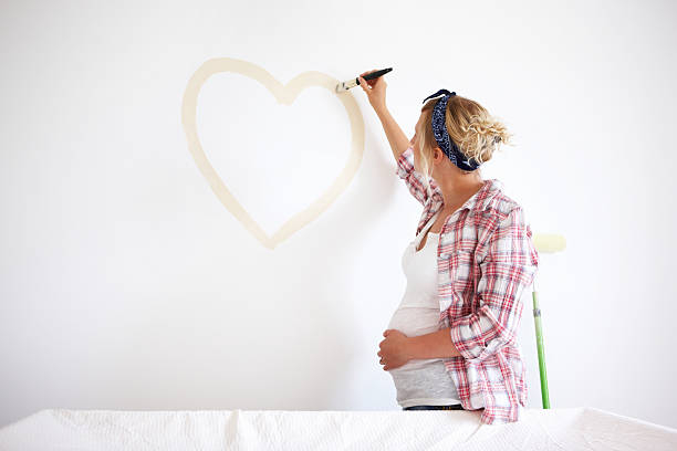 Expectant Mother Painting a Heart