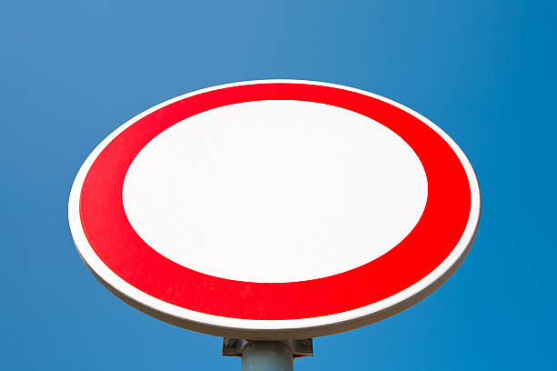 istock No entry sign against blue sky 184648726