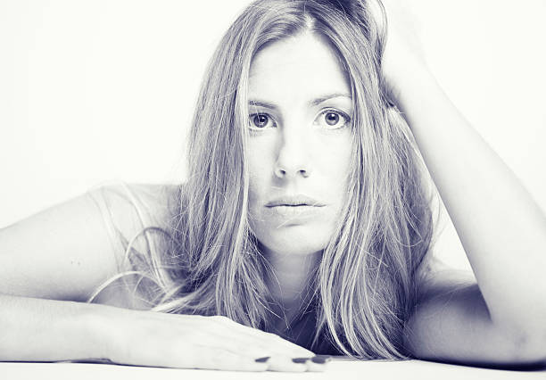 Young beautiful woman looking at camera. More files of this model and series on port. Made with professional make up and studio equipment. Vertical format.