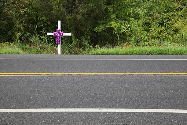 istock White memorial cross at the roadside 184648907
