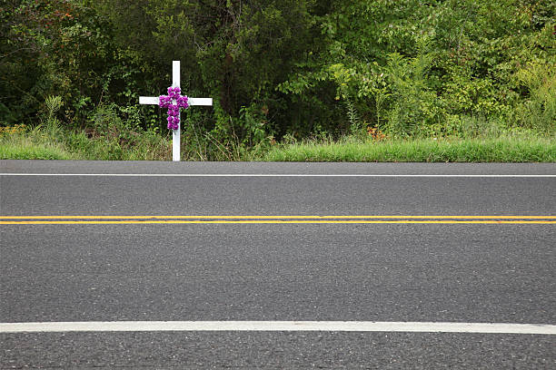 White memorial cross at the roadside stock photo