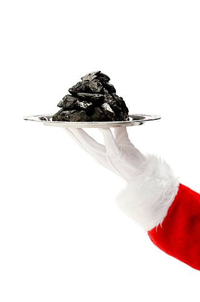 Hand of Santa Claus - Coal Santa Claus's hand, serving up a pile of coal on a silver platter, against a white background silver platter stock pictures, royalty-free photos & images