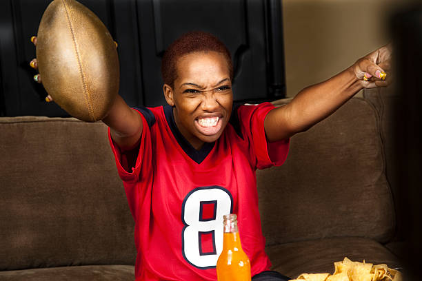 istock Football fan at home watching the game 184649224
