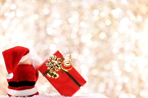 istock Santa sitting with his christmas present 184649387