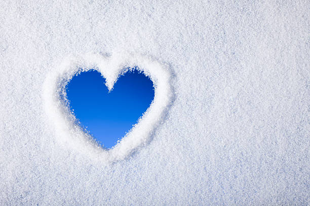 Heart shape painted on frozen window Photography of a Heart shape painted on a frozen window. icicles melting stock pictures, royalty-free photos & images