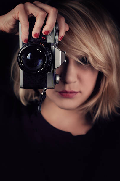 istock Young Woman & Camera 184650411