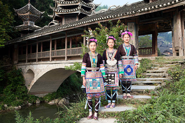 Chinese New Year, Chinese girl wearing ethnic minority costumes in an ancient village