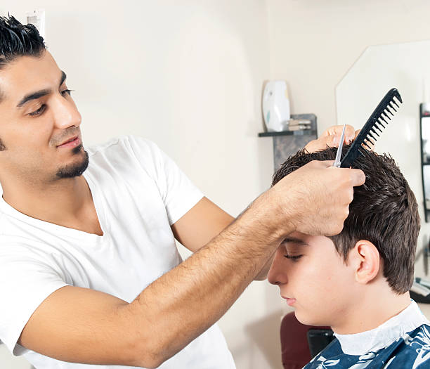 istock young man in the hair salon 184650829