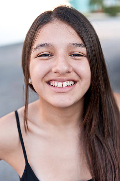 istock Smiling thirteen years old hispanic girl 184650908