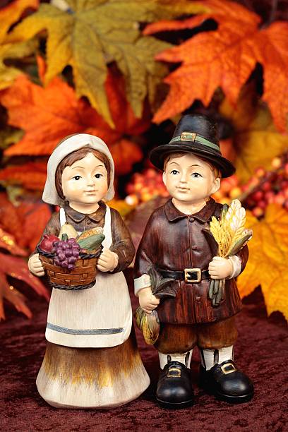 istock Thanksgiving Pilgrims with Autumn Leaves 184651060