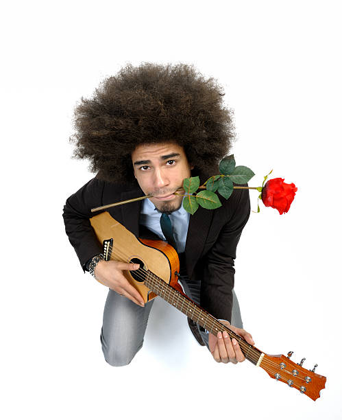 cool hombre tocando la guitarra serenade romántica - isolated on white studio shot guitar young men fotografías e imágenes de stock