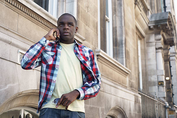 istock Young man talking on the phone 184652706