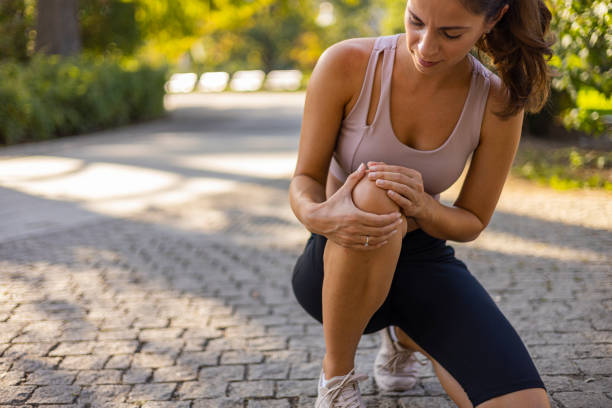 istock Young woman feeling pain in her knee. 1846535411
