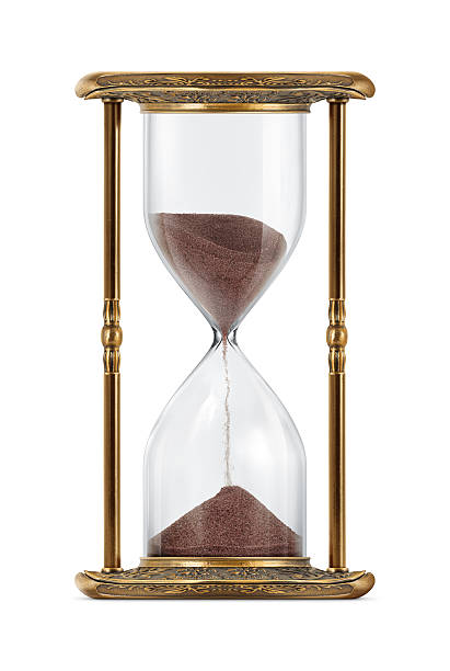 Ancient Looking Hourglass An ancient looking hourglass isolated on white background. timer photos stock pictures, royalty-free photos & images
