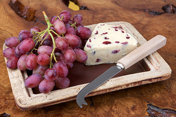 Piece of French Roquefort Cheese stock photo. Shadow DOF. Developed from RAW; retouched with special care and attention; Small amount of grain added for best final impression. 16 bit Adobe RGB color profile.