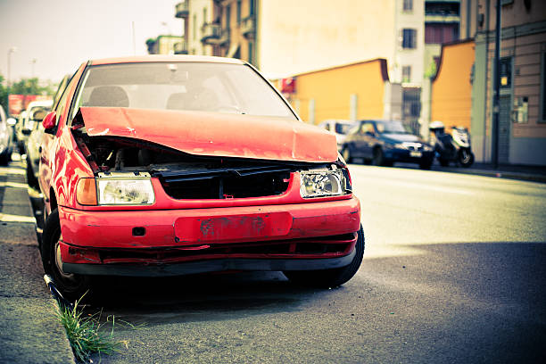 Broken Abandoned Car on the Street Broken car parked on the street beat up car stock pictures, royalty-free photos & images