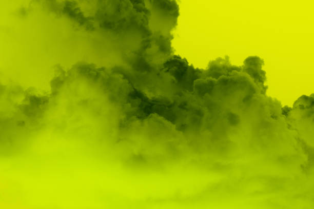 Green gas cloud background. Lime green color to dark green smoky gaseous cloud with chartreuse background. Ominous bellowing foggy gas.