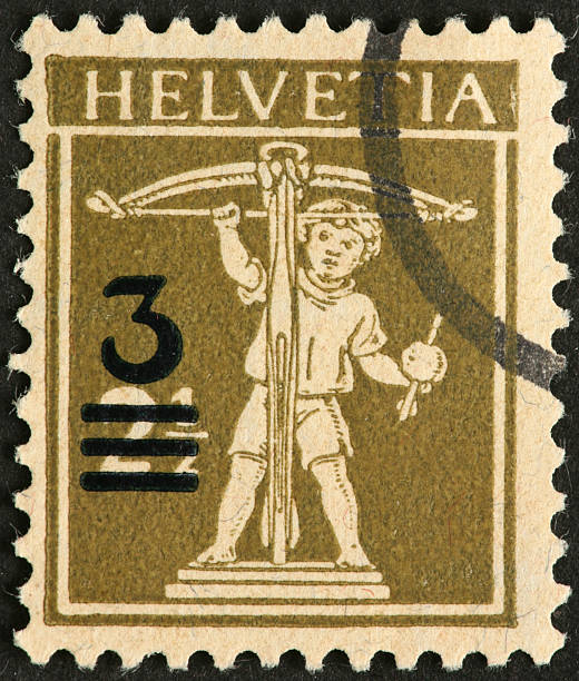 istock boy with crossbow on old Swiss postage stamp 184654214